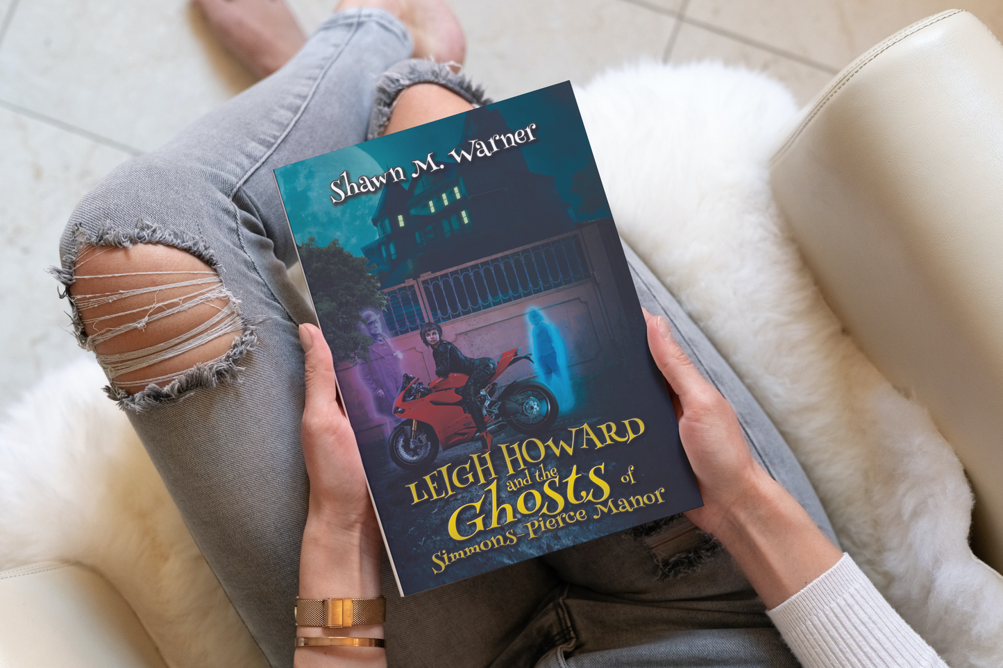 Photo of a young woman holding the book
